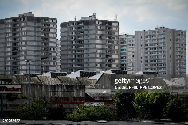 This picture taken on May 21, 2018 shows high rise buildings in Bobigny, in the suburbs of the French capital Paris. - French President Emmanuel...