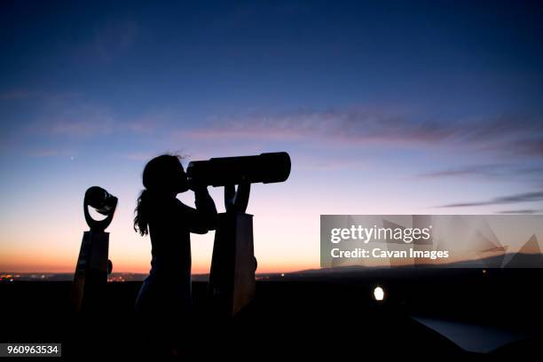 girl looking through binoculars - girls wearing see through clothes fotografías e imágenes de stock