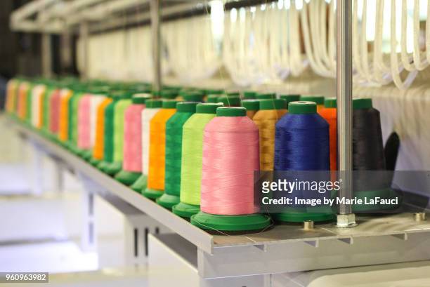 embroidery spools with thread - polyester fotografías e imágenes de stock