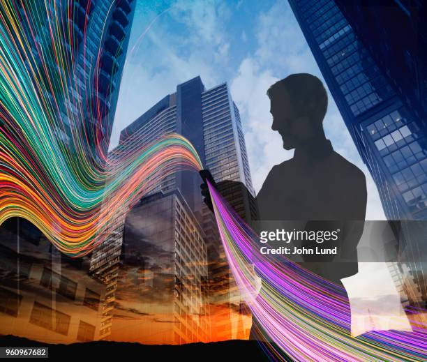 mobile connected businessman - digital composite phone stock pictures, royalty-free photos & images