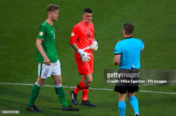 Republic of Ireland's Nathan Collins and goalkeeper James Corcoran speak with referee Zbynek Proske
