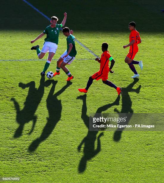 Ireland's Troy Parrott takes on Netherland's Daishawn Redan during the UEFA European U17 Championship quarter final match at the Proact Stadium,...