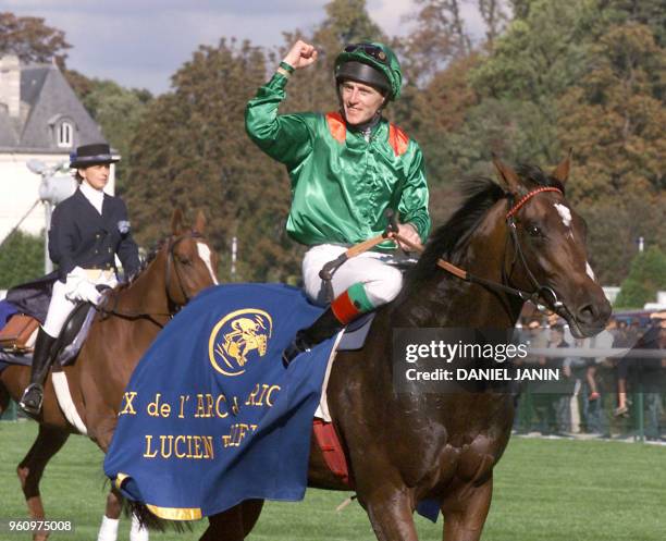 Irish jockey Johnny Murtagh ridding Sinndar celebrates after winning the Group One Prix de l'Arc de Triomphe at the Longchamp hippodrome in Paris 01...