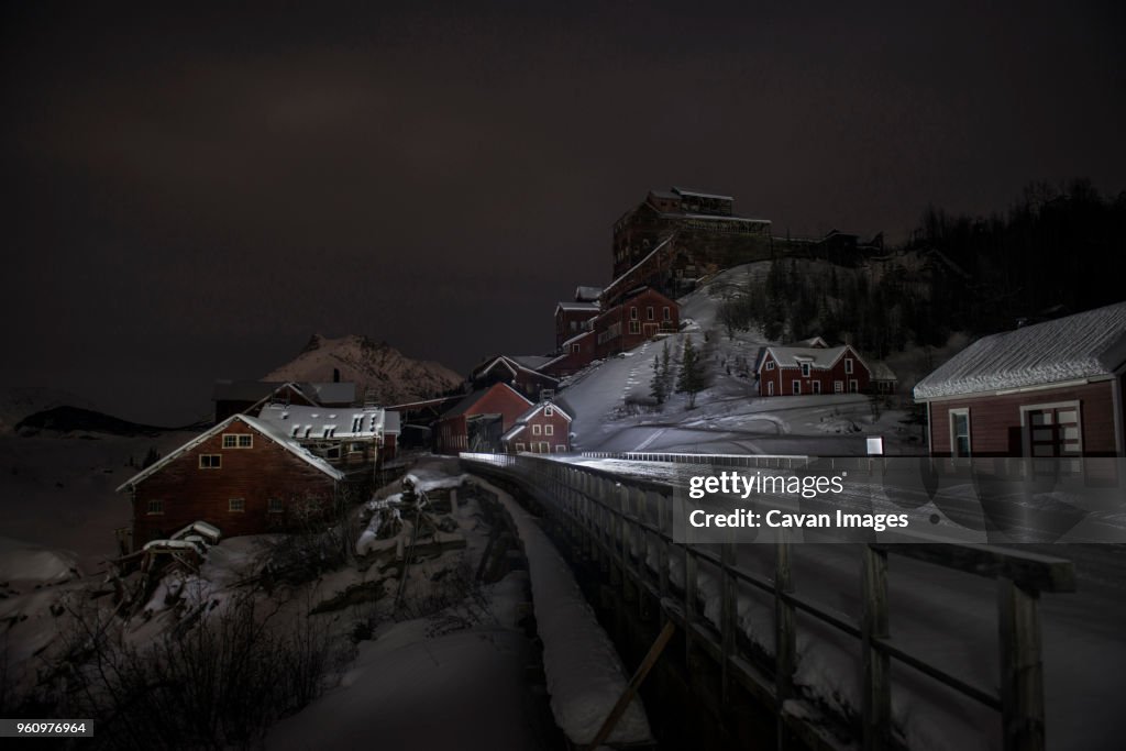Copper mine buildings against sky during winter