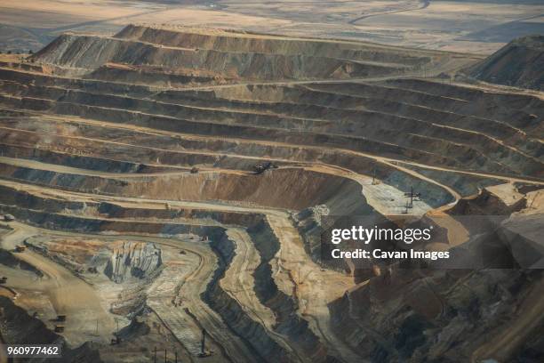 high angle view of mining at bingham canyon - bingham canyon mine stock pictures, royalty-free photos & images