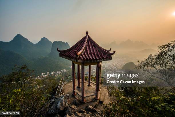 high angle view of gazebo against sky during sunrise - xingping stock pictures, royalty-free photos & images