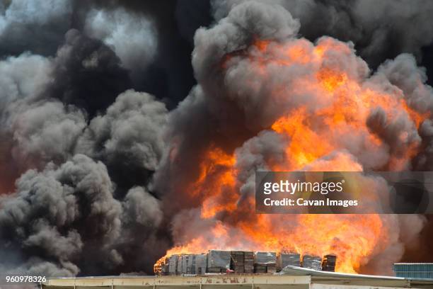 smoke emitting from burning crates in factory - incineration plant stock pictures, royalty-free photos & images