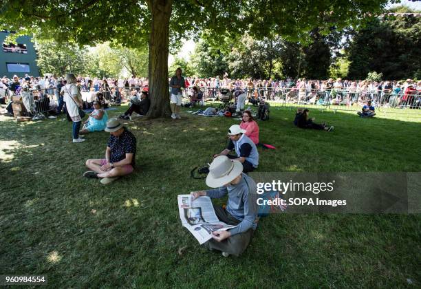 Man seen reading the news about the Royal Wedding on a newspaper. The wedding of Prince Harry and Meghan Markle was held on 19 May 2018 in St...