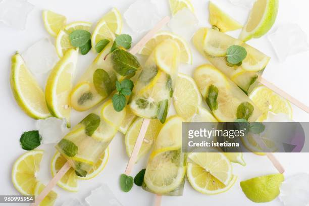 green tea ice lollies with  lemon and mint - ice lolly stock pictures, royalty-free photos & images