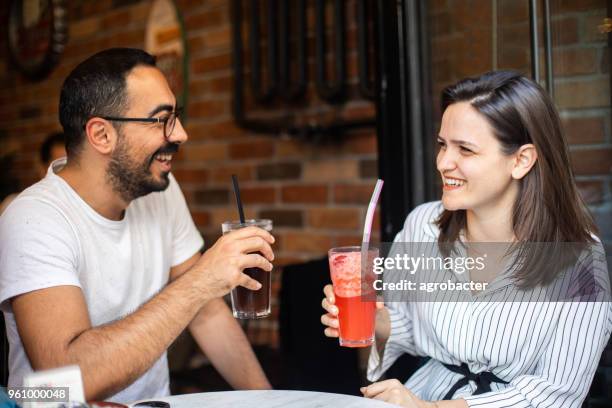 friends hanging out at cafe - woman looking through ice stock pictures, royalty-free photos & images