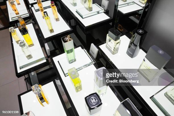 Chanel SA perfume bottles sits on display at the new beauty floor of a Saks Fifth Avenue Inc. Department store in New York, U.S., on Friday, May 18,...
