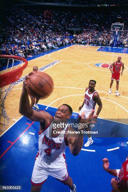 Rick Mahorn of the New Jersey Nets grabs the rebound against the Chicago Bulls on April 11, 1996 at Brendan Byrne Arena in East Rutherford, New...