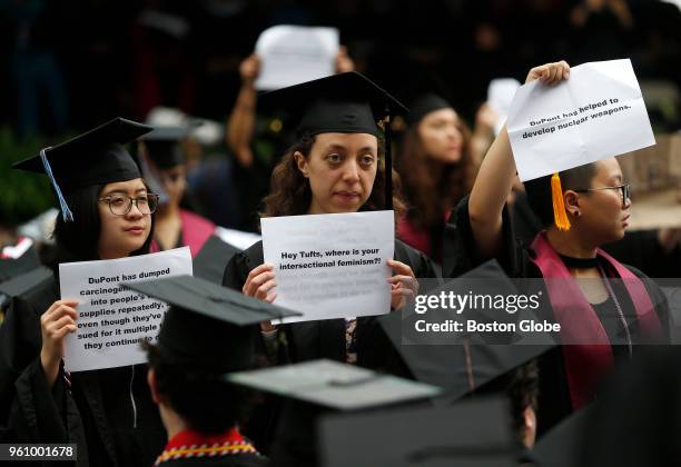 Ash Ng, who was graduating with a degree in Political Science and American Studies, left, and Laura Guinto, graduating with a degree in Biochemistry,...