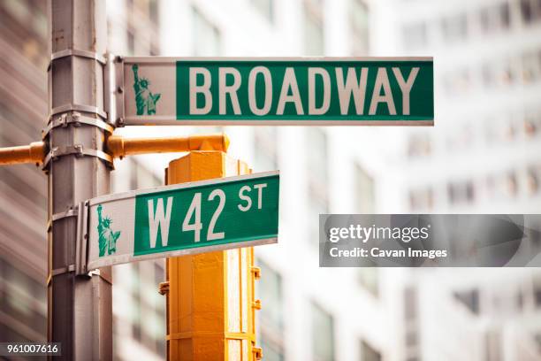 low angle view of road sign in city - broadway imagens e fotografias de stock