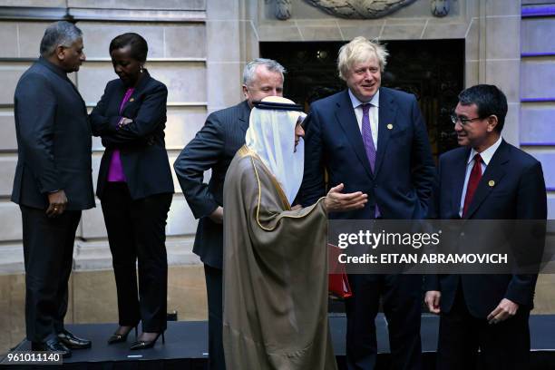 The Minister of Foreign Affairs from Saudi Arabia Adel Al-Jubeir speaks with his Japanese counterpart Tara Kono, as United States Deputy Secretary of...