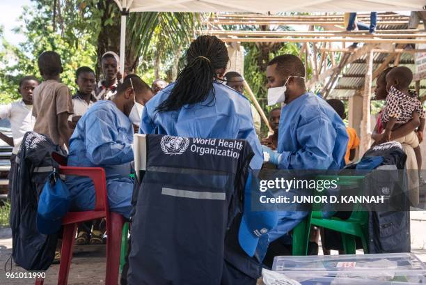 Team of World Health Organization members prepares to launch the Ebola vaccination drive in a neighborhood on the outskirts of Mbandaka on May 21,...