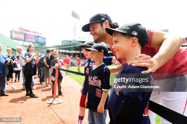 Joe Kelly of the Boston Red Sox greets fans before a game against the Baltimore Orioles at Fenway Park on May 20, 2018 in Boston, Massachusetts.