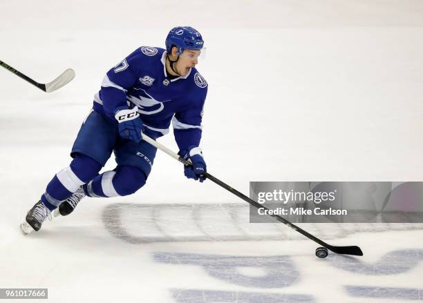 Yanni Gourde of the Tampa Bay Lightning moves the puck against the Washington Capitals during the first period in Game Five of the Eastern Conference...