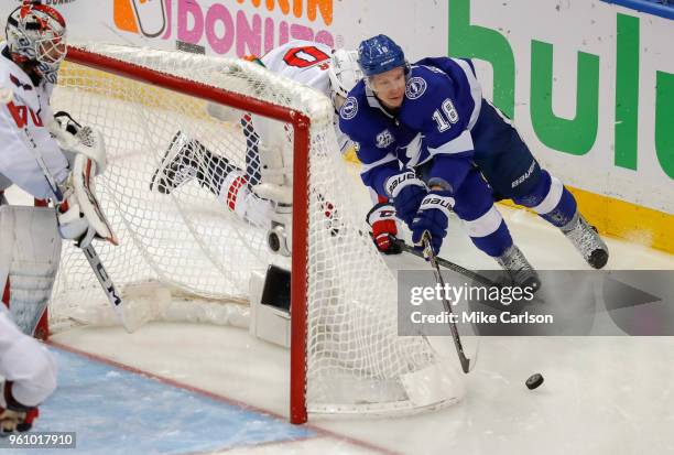 Ondrej Palat of the Tampa Bay Lightning brings the puck behind the net of Braden Holtby of the Washington Capitals during the third period in Game...