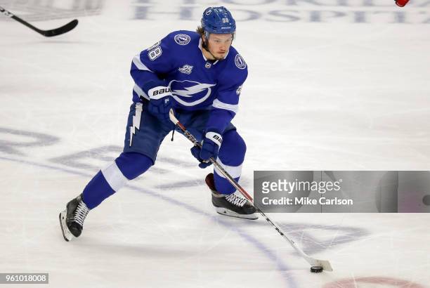 Mikhail Sergachev of the Tampa Bay Lightning moves the puck against the Washington Capitals during the third period in Game Five of the Eastern...