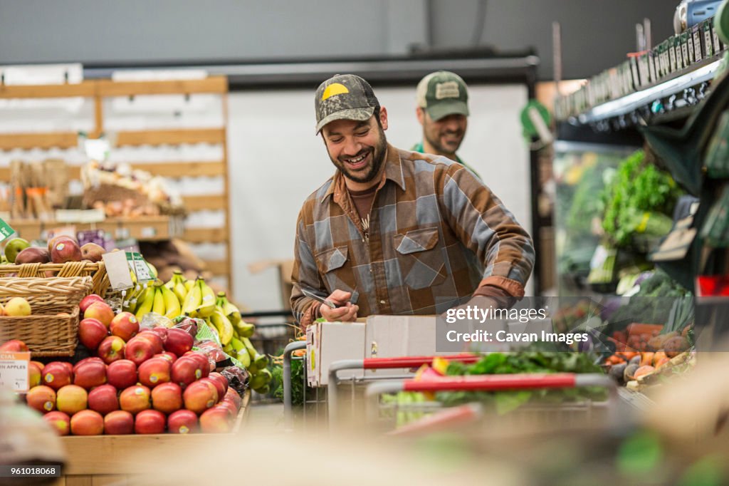 Male workers working at supermarket