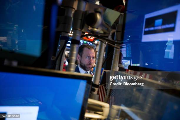 Trader works on the floor of the New York Stock Exchange in New York, U.S., on Monday, May 21, 2018. U.S. Stocks surged and the dollar strengthened...