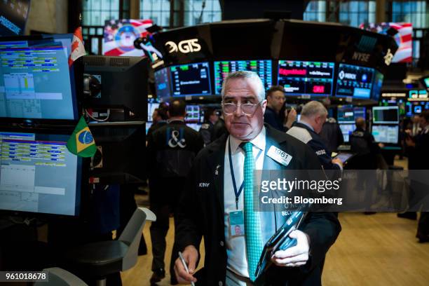 Trader works on the floor of the New York Stock Exchange in New York, U.S., on Monday, May 21, 2018. U.S. Stocks surged and the dollar strengthened...