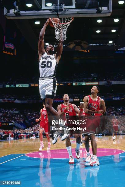 David Robinson of the San Antonio Spurs dunks the ball against the Chicago Bulls on November 22, 1995 at the Alamodome in San Antonio, Texas. NOTE TO...