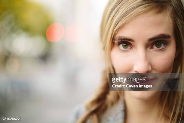 close-up portrait of confident woman - fishtail braid stock pictures, royalty-free photos & images