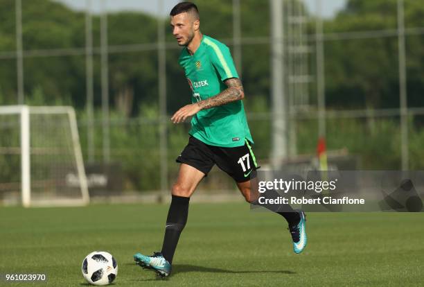 Nikita Rukavytsya of Australia runs with the ball during the Australian Socceroos Training Session at Gloria Football Club on May 21, 2018 in...