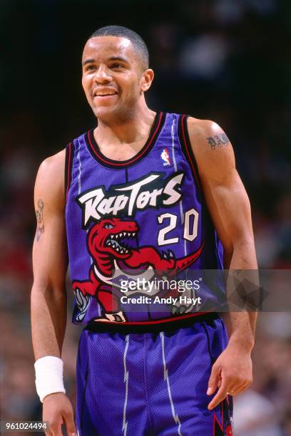 Damon Stoudamire of the Toronto Raptors looks on during the game against the Chicago Bulls on December 22, 1995 at the United Center in Chicago,...