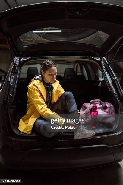 getting ready for jogging - getting dressed stock pictures, royalty-free photos & images
