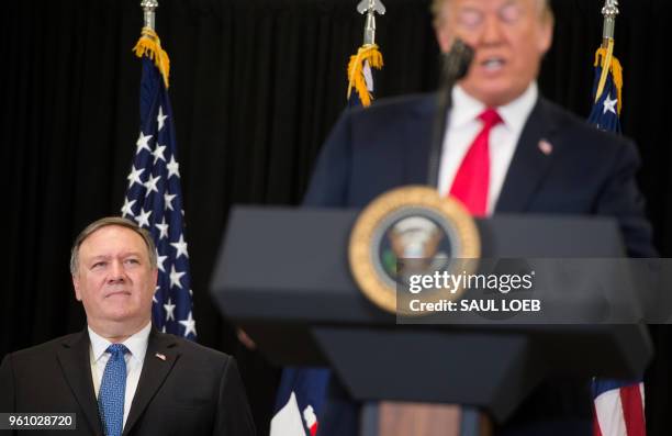 President Donald Trump speaks alongside US Secretary of State Mike Pompeo during the swearing-in ceremony for Gina Haspel as Director of the Central...