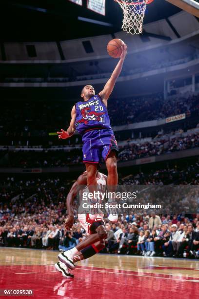 Damon Stoudamire of the Toronto Raptors goes to the basket against the Chicago Bulls on November 7, 1995 at the United Center in Chicago, Illinois....