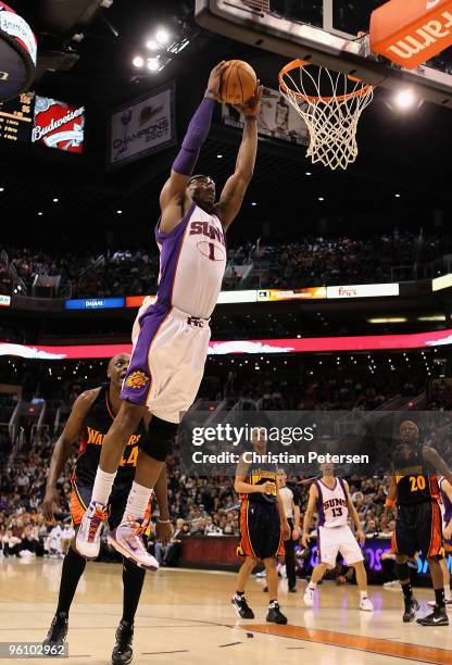 Amar'e Stoudemire of the Phoenix Suns slam dunks the ball against the Golden State Warriors during the NBA game at US Airways Center on January 23,...