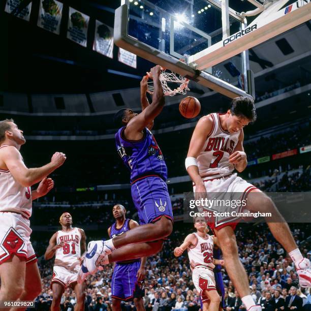Oliver Miller of the Toronto Raptors dunks the ball against the Chicago Bulls on November 7, 1995 at the United Center in Chicago, Illinois. NOTE TO...