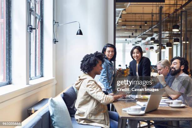 happy business people having discussion during meeting in office - online brainstorming stock pictures, royalty-free photos & images