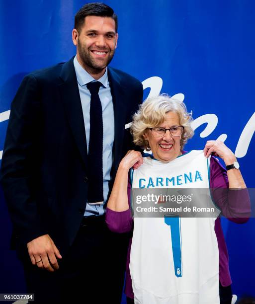 Real Madrid captain Felipe Reyes and Mayor of Madrid Manuela Carmena pose for a photo during Real Madrid basketball team celebration after they won...