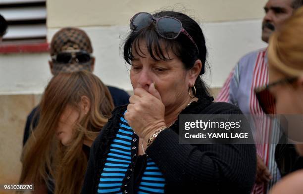Marilin Almaguer, mother of 19-year-old Mailen Diaz Almaguer, one of the survivors of the plane crash, cries after receiving a medical report on her...