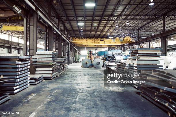 metal sheets and machineries in warehouse - foundry stock-fotos und bilder