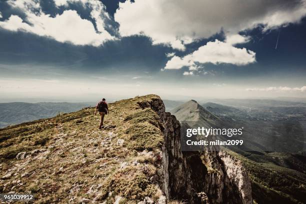 man on top of a mountain - summit milan stock pictures, royalty-free photos & images