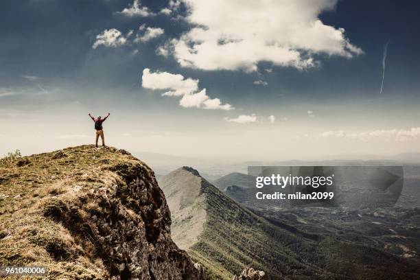 man on top of a mountain - summit milan stock pictures, royalty-free photos & images