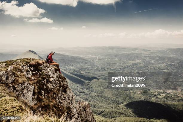 man on top of a mountain - summit milan stock pictures, royalty-free photos & images