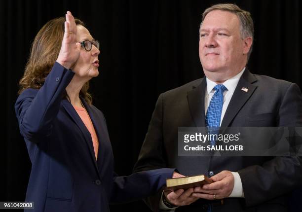 Gina Haspel is sworn in as the Director of the Central Intelligence Agency alongside US Secretary of State Mike Pompeo during a ceremony at CIA...