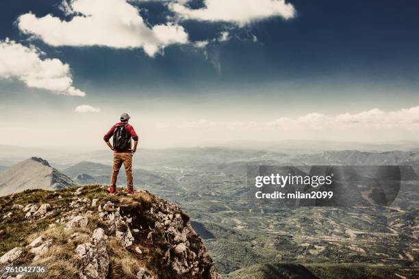 man on top of a mountain - summit milan stock pictures, royalty-free photos & images