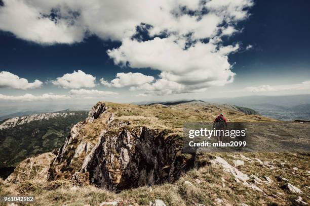 man on top of a mountain - summit milan stock pictures, royalty-free photos & images