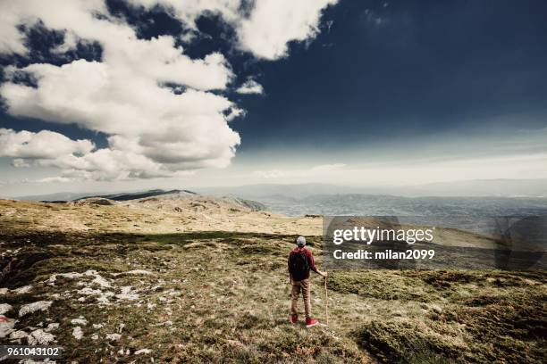 man on top of a mountain - summit milan stock pictures, royalty-free photos & images