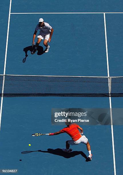 Rafael Nadal of Spain misses a forehand in his fourth round match against Ivo Karlovic of Croatia during day seven of the 2010 Australian Open at...
