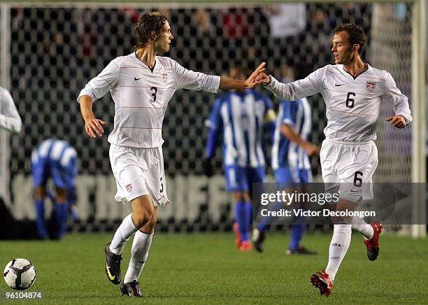 Clarence Goodson of USA celebrates his second half goal against Honduras with teammate Brad Davis during their international friendly on January 23,...