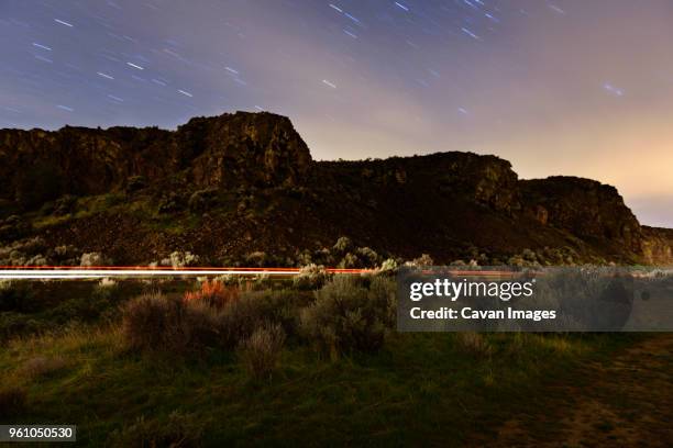 light trails on mountain road at gifford pinchot national forest - gifford pinchot national forest stock pictures, royalty-free photos & images